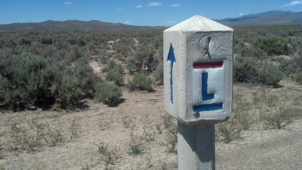 A Lincoln Highway marker stands alongside the Loneliest Road in America. (Photo by Michael E. Grass)